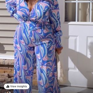 colorful wide leg jump suit. zipper in bag
